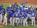 Members of the Venezuela team celebrate after defeating the United States in the championship game of the World Baseball Classic on March 17, 2026, in Miami.
