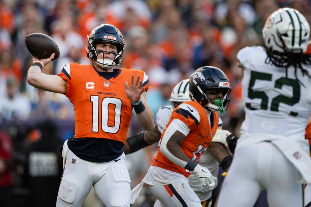 Quarterback Bo Nix (10) of the Denver Broncos attempts a pass during a game against the Green Bay Packers on Sunday, Dec. 14, 2025, at Empower Field at Mile High Stadium in Denver. (Photo by Timothy Hurst/The Denver Post)