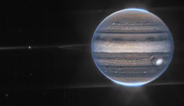 A marble-like planet in space, against the darkness of the cosmos, with a blue glowing light all around it.