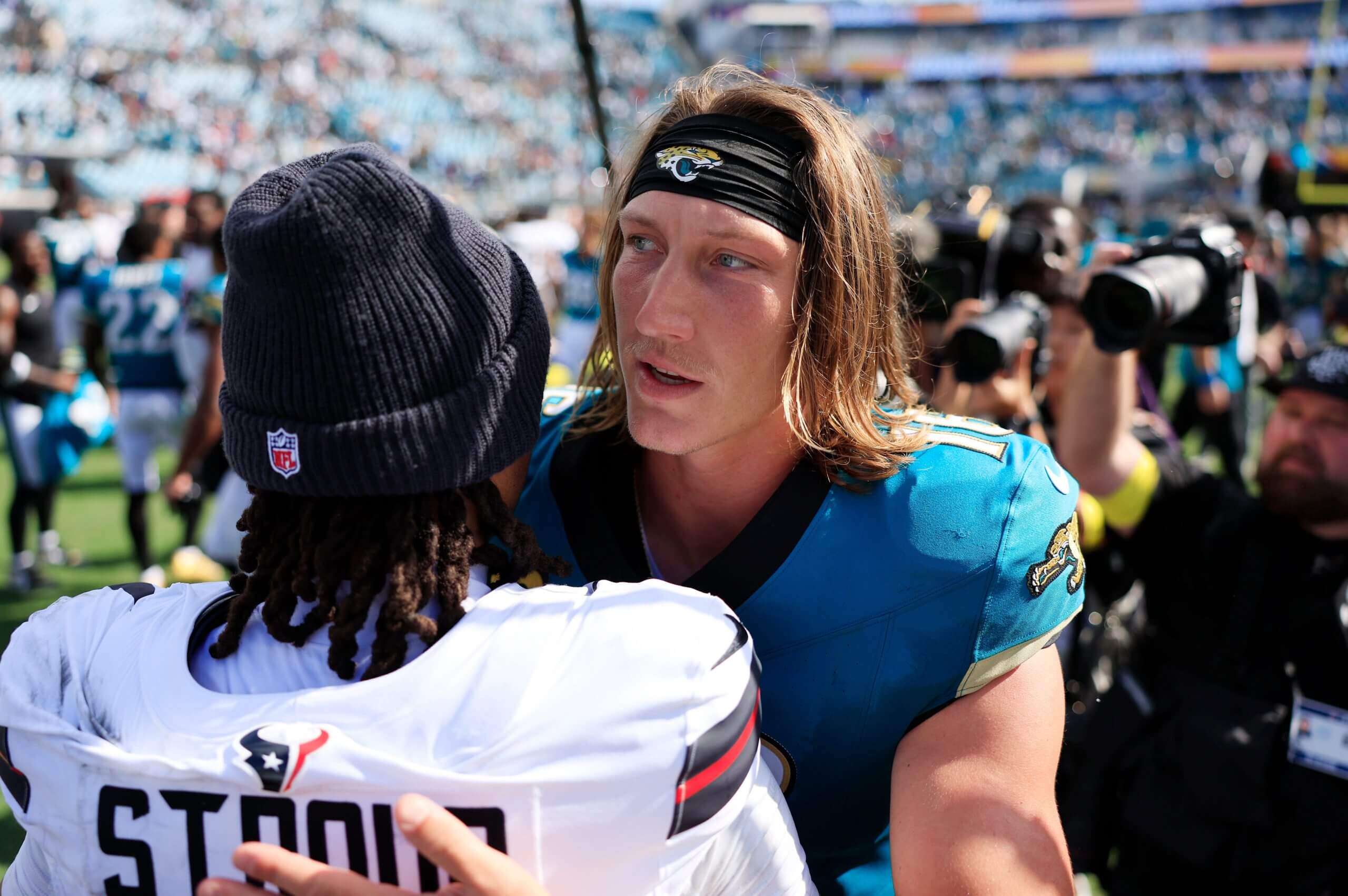 C.J. Stroud of the Texans and Trevor Lawrence of the Jaguars embrace after a 2025 game. 