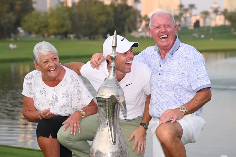 Rory McIlroy with his parents, Rosie and Gerry McIlroy, along with the trophy after the final round of the Dubai Desert Classic in the UAE in January, 2024. Photograph: Ross Kinnaird/Getty Images