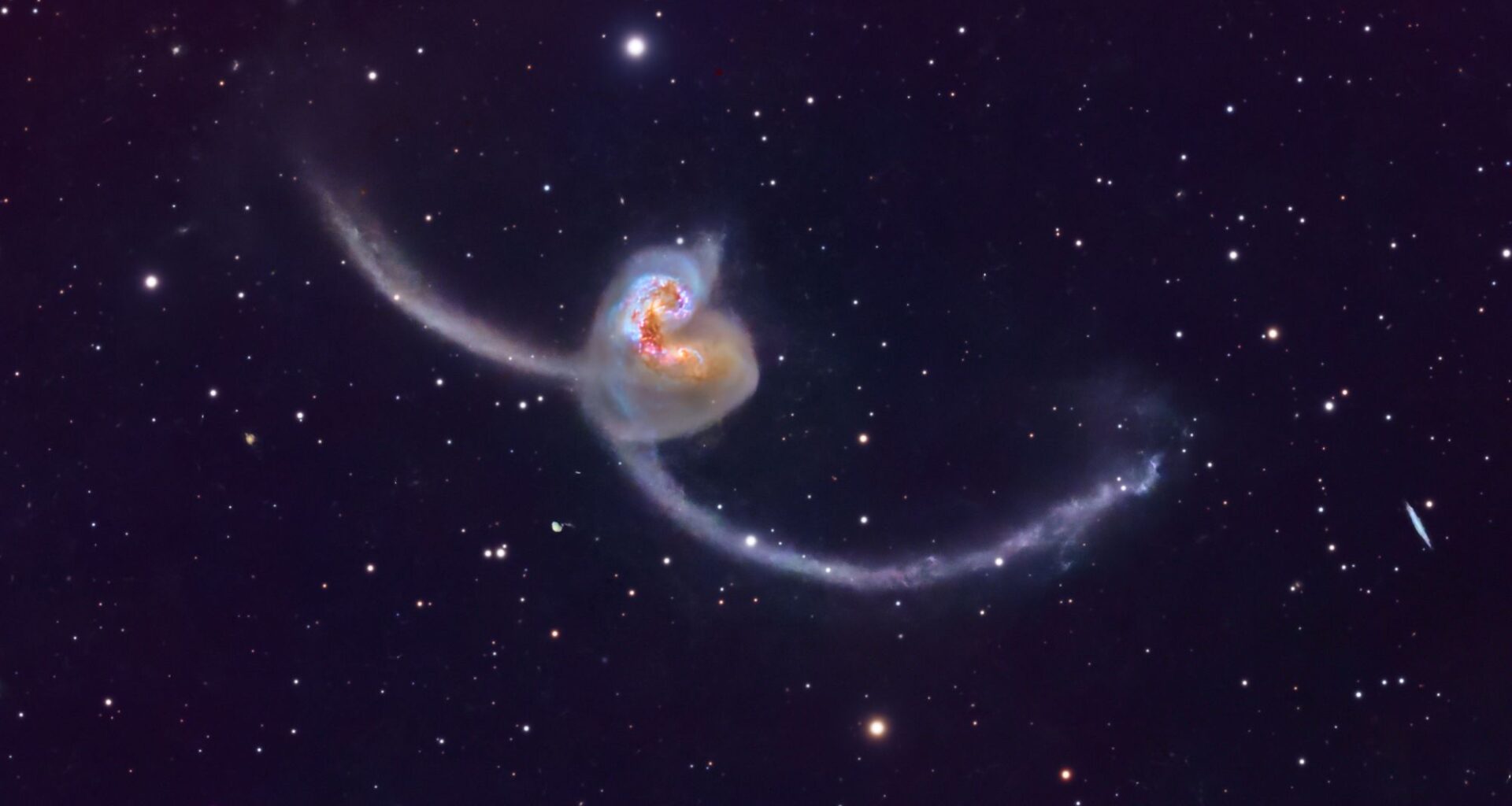 Astrophotographer captures spectacular photo of Antennae Galaxies dueling in deep space