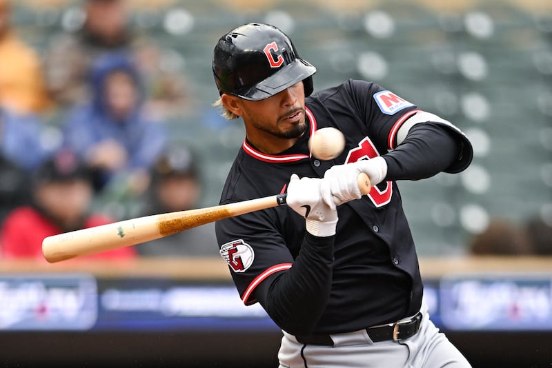 MINNEAPOLIS, MINNESOTA - MAY 21: Gabriel Arias #13 of the Cleveland Guardians strikes out on a check swing in the ninth inning against the Minnesota Twins during game one of a doubleheader at Target Field on May 21, 2025 in Minneapolis, Minnesota. (Photo by Stephen Maturen/Getty Images)