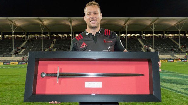 Wyatt Crockett of the Crusaders is presented with a sword in 2017 in Christchurch.