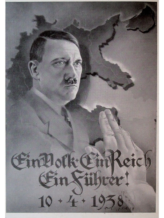 A poster of Adolf Hitler and a slogan that says "One People, One Realm, One Leader."