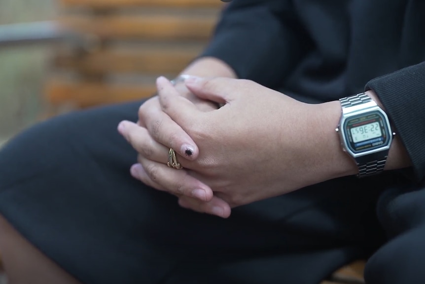 A close-up of a person's hands. 