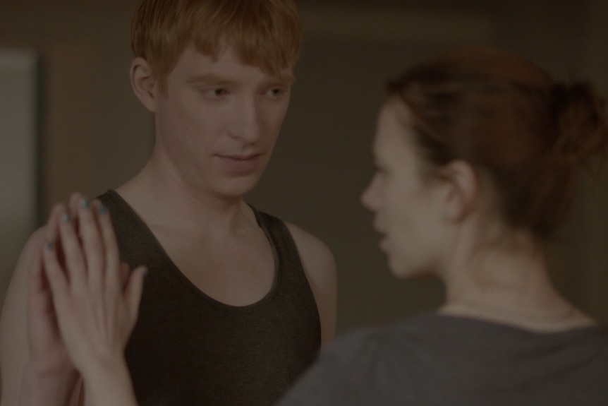 From a Black Mirror episode, an AI replica of a dead husband holds the hand of his grieving wife.]