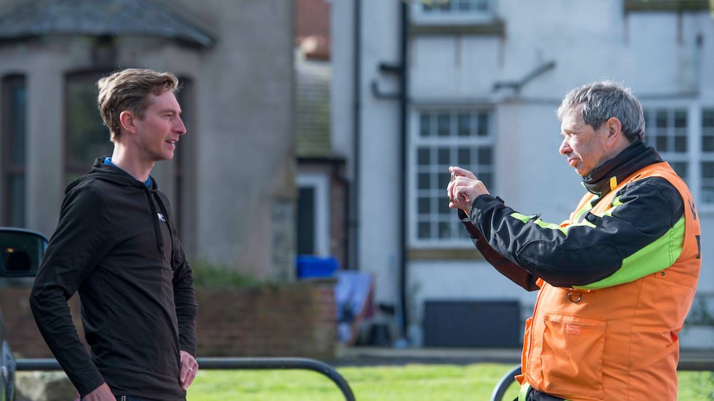 Larry Hickmott interviewing a British rider at a UK cycling race