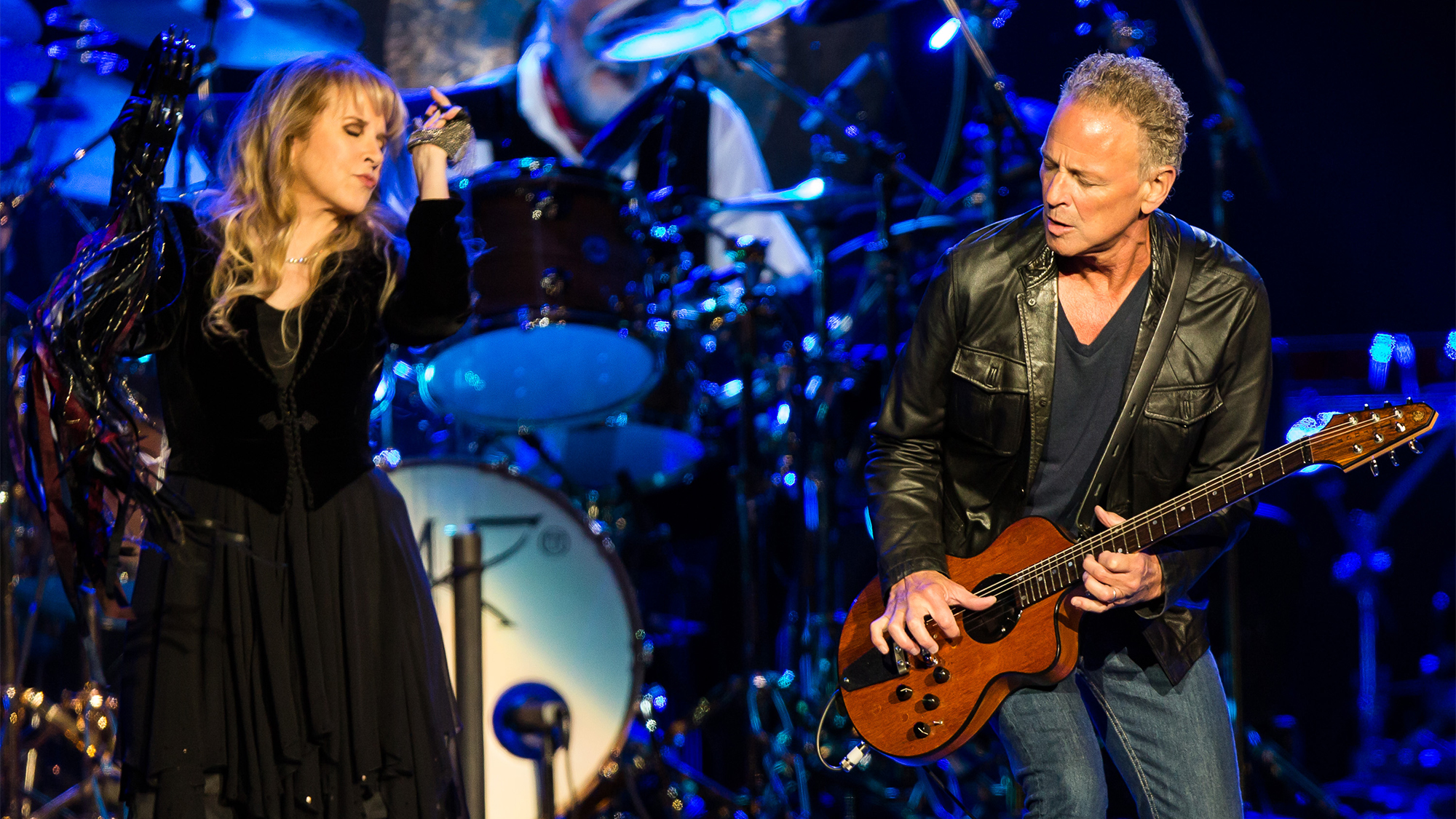Vocalist Stevie Nicks (L) and vocalist/guitarist Lindsey Buckingham of Fleetwood Mac perform at Staples Center on July 3, 2013 in Los Angeles, California.