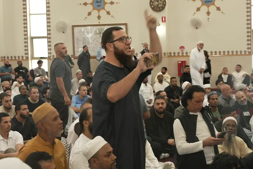 Men gathered at Islamic mosue. 