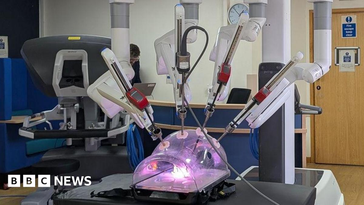 The machine looks like a plastic container with purple light inside, with lots of metal rods poking into it.