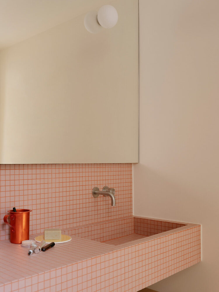 a tiled basin extends from the wall