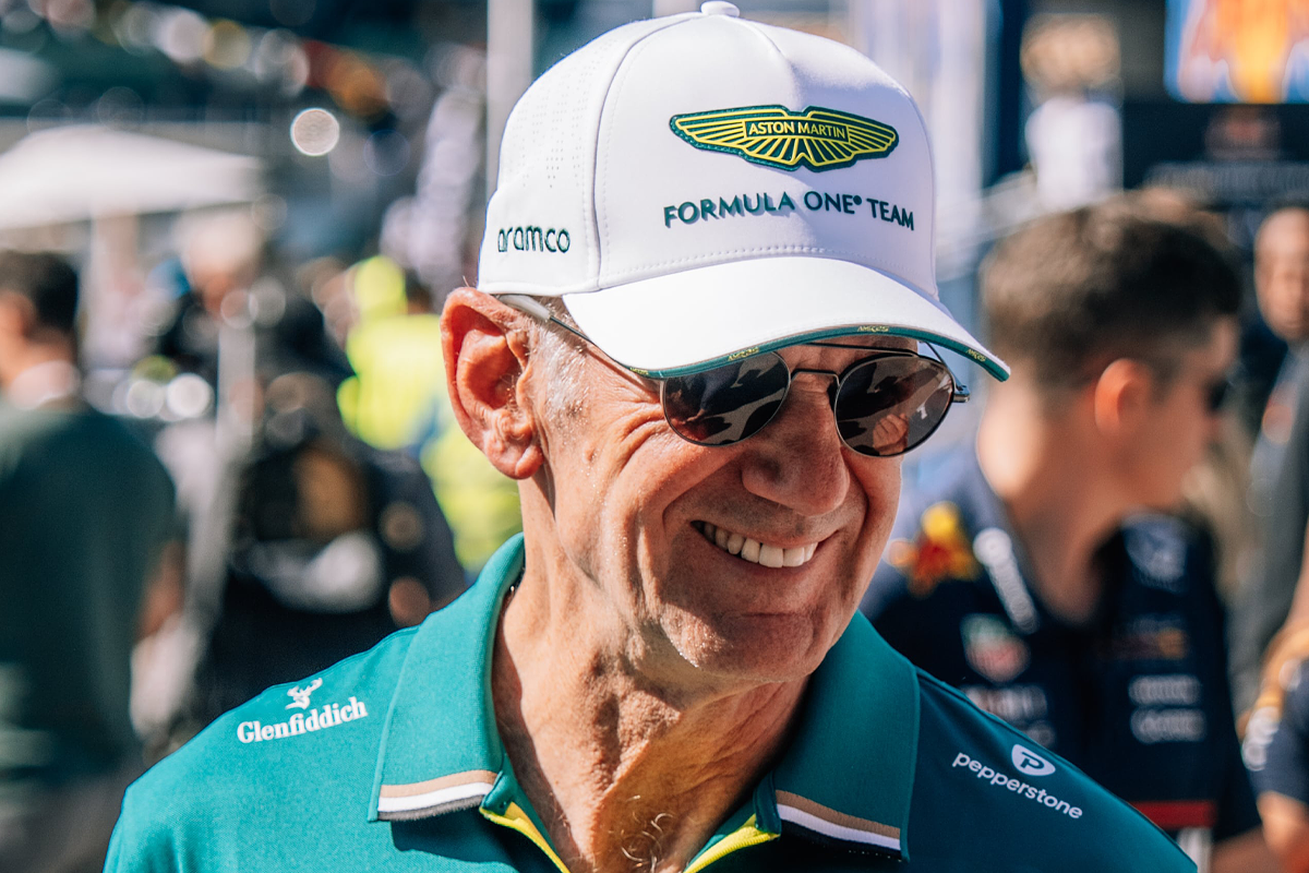 Newey smiling in his aston martin cap