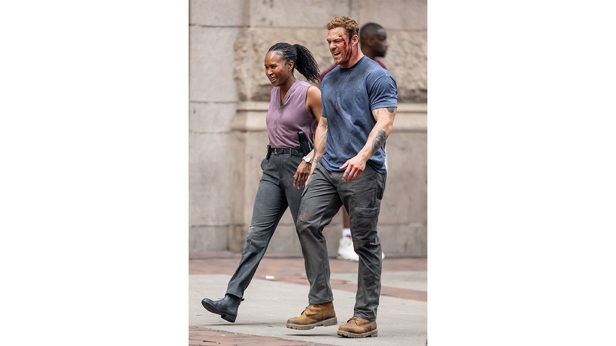 Sydelle Noel and Alan Ritchson filming scenes on the set of the TV series "Reacher."