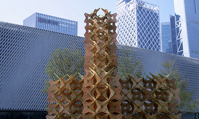 hundreds of interlocking star modules build a porous timber installation - 4