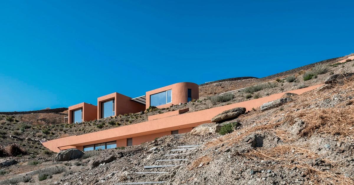 olen resort embeds into greek island slope across three terraced levels