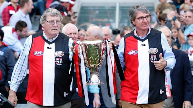1966 Premiership players Kevin 'Cowboy' Neale and Barry Breen bring out the 1966 Premiership cup in 2016.