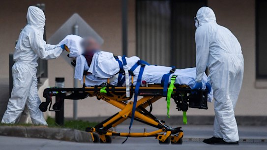 A St Basil’s resident is evacuated from the home in July 2020.