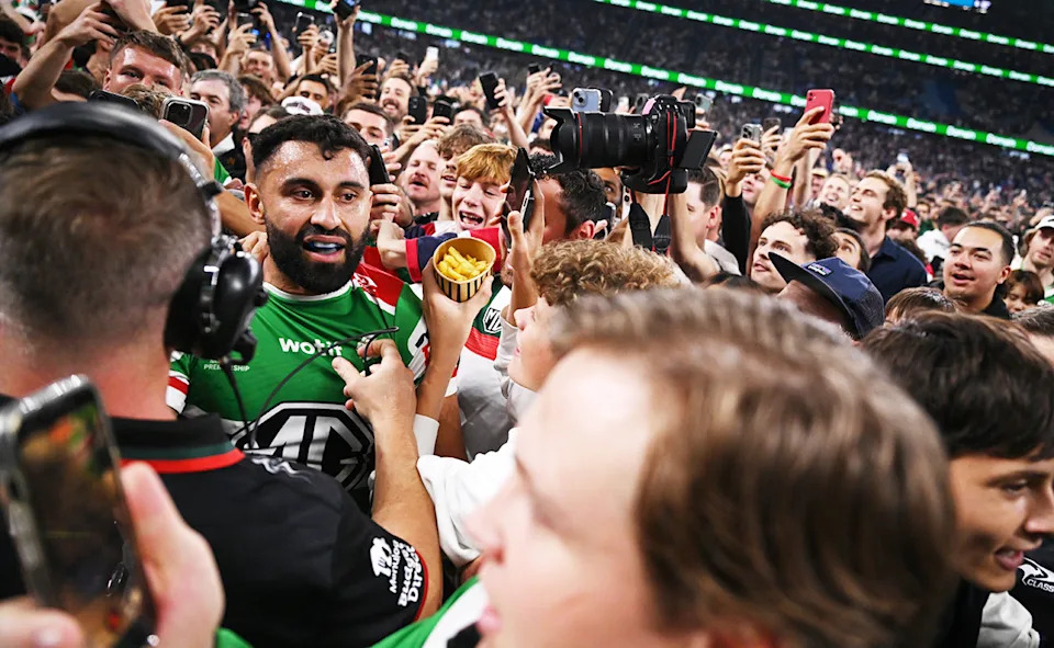 Alex Johnston, pictured here being mobbed after he broke the NRL try-scoring record.
