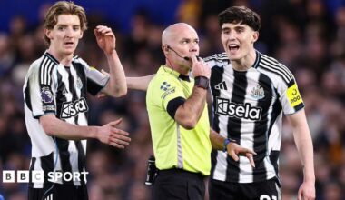 Tino Livramento of Newcastle United and Anthony Gordon of Newcastle United complain to match referee Paul Tierney