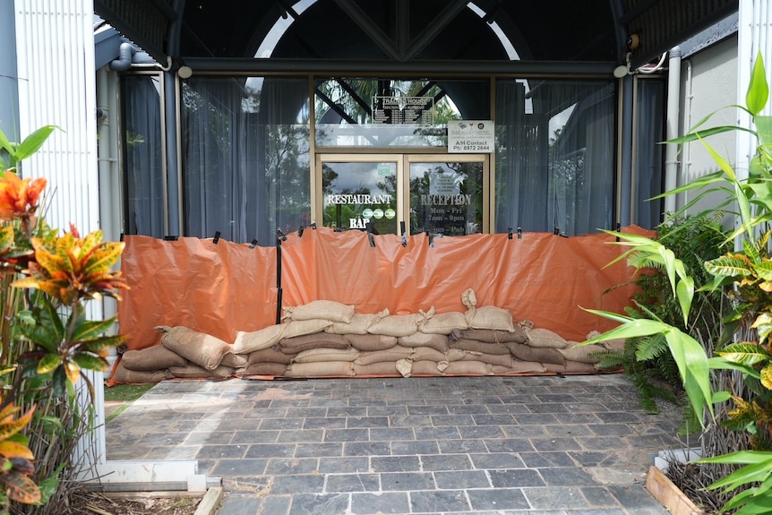 Sandbags in front of opening to restaurant
