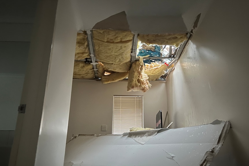 Roof fallen in and insulation falling down.