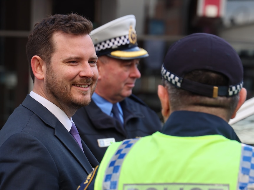 Felix Ellis with police officers.