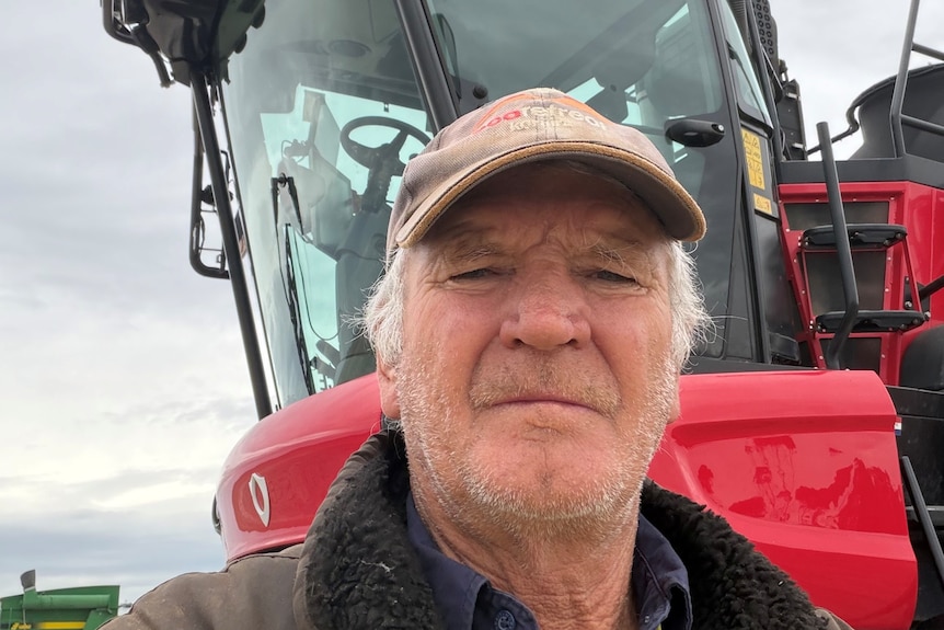 Farmer David smiling for a selfie next to his truck