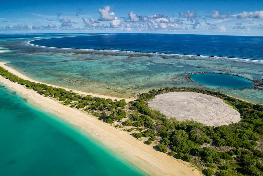 The dome on Runit Island with a crater left behind by another nuclear test.