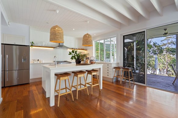 The kitchen leads to an outdoor area.