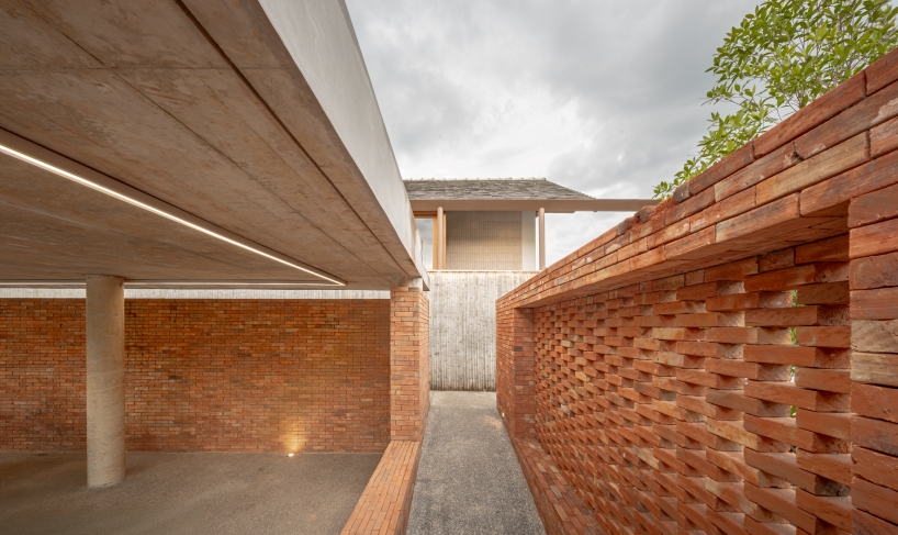 brick and concrete sculpt elevated riverfront residence in thailand by bodinchapa architects - 5