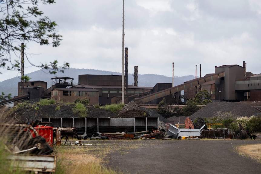 A large smelter looking dark and deserted.