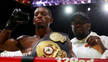 Ezra Taylor hits the pads with trainer Malik Scott