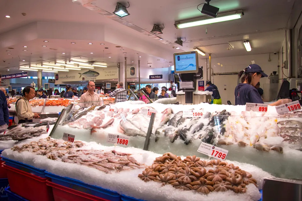 Unidentified people at the Sydney Fish Market. 
