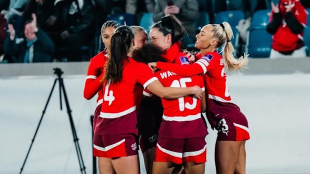 Alisha Lehmann celebrates with her Swiss teammates during an international friendly.