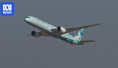 Travellers sleep at airport amid warning of 'significant disruptions' from Middle East conflict