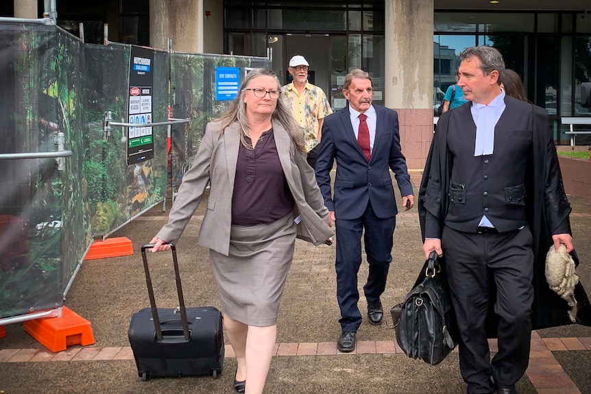 people leaving a courthouse