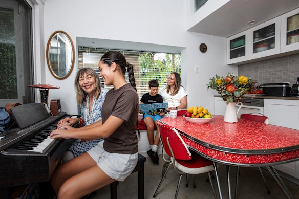 Home owner Carmel Grimmett with her granddaughter Telesia, grandson Jack and his mum Maude Sturm. SAHA sees multigenerational homes as a way of solving the housing crisis. 