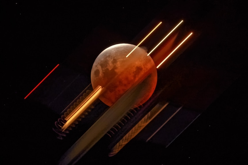A red moon with lines of light striking through it in a dark sky