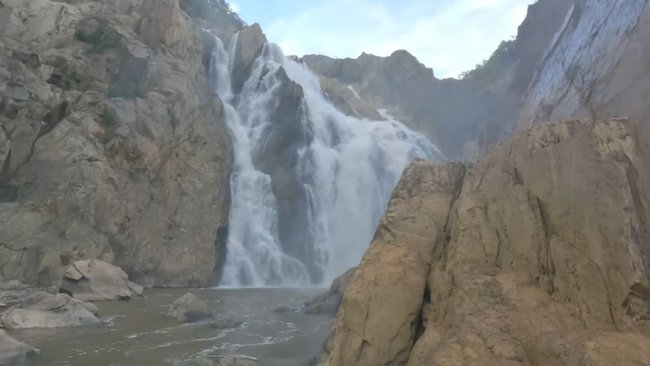 Barron Gorge later as water surged through the channel, rapidly rising around the area where the teenagers became stranded.
