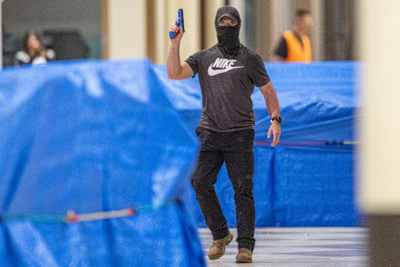 A gun-wielding “offender” inside the shopping centre. 