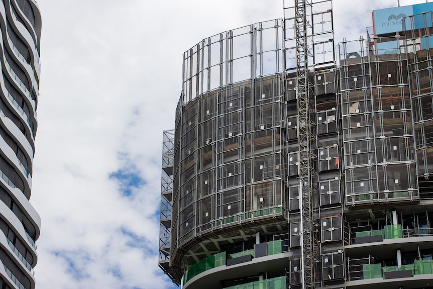 Photos of a multi-residential tower being constructed.