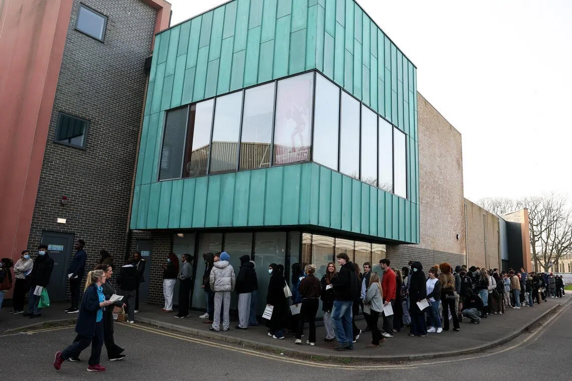 People, mainly students, queueing to receive Meningitis B vaccinations at a sports centre on the University of Kent campus on March 20, following an outbreak in Kent.