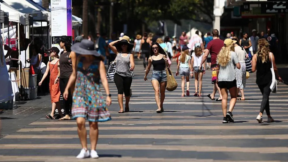 People walk on Manly Beach promenade in Sydney, Australia, on Sunday, Nov. 15, 2020. 