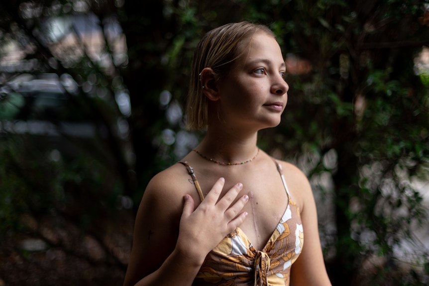 A blonde woman posing for a photo.