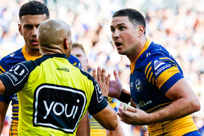 Mitchell Moses questions the decision of a referee 