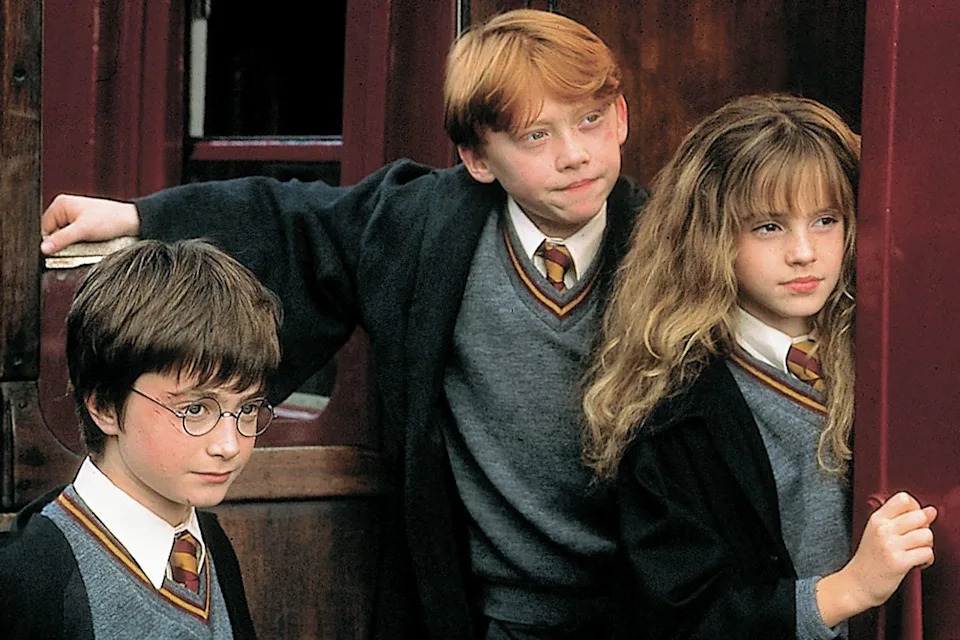 Daniel Radcliffe, Rupert Grint, and Emma Watson in 'Harry Potter and the Sorcerer's Stone'Credit: Peter Mountain/Warner Bros.