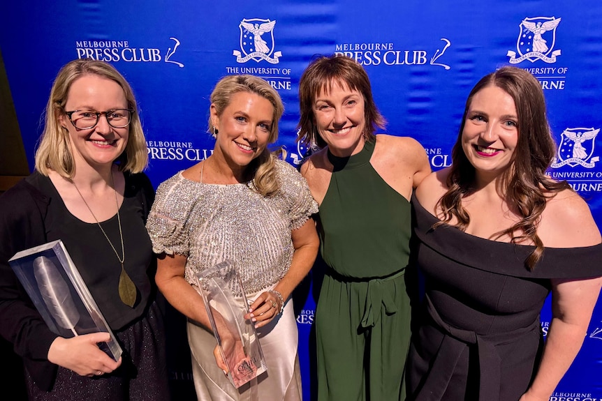 Four smiling women at the Quill Awards in Melbourne. 