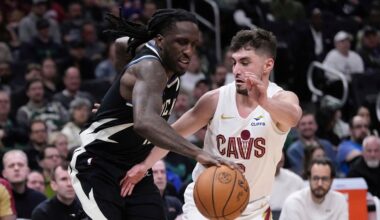 Cleveland Cavaliers' Ty Jerome knocks the ball from Milwaukee Bucks' Taurean Prince during the first half of an NBA basketball game Sunday, Mar. 9, 2025, in Milwaukee. (AP Photo/Morry Gash)