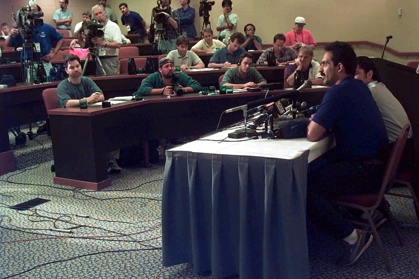 Raed Ahmed, an Iraqi weightlifter, speaks at a news conference at an Atlanta hotel later he defected.